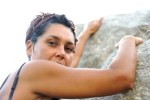 Female climbing rocks on mountain