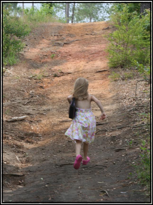 Child running up a path