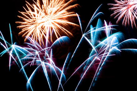 Firework streaks in the night sky during celebrations.