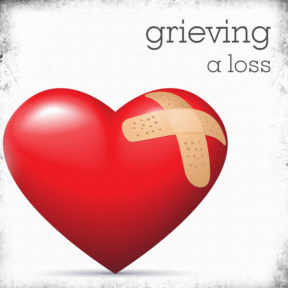 Grieving a loss picture with bandaid on a heart