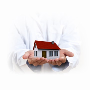 house being held in two open hands