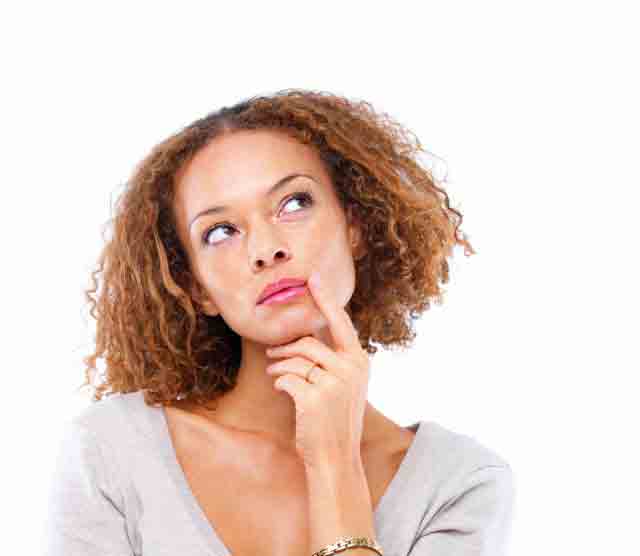 Woman with finger to lip, thinking