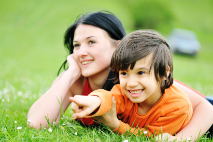 Mom and son in grass