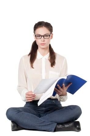 Girl turning page in book
