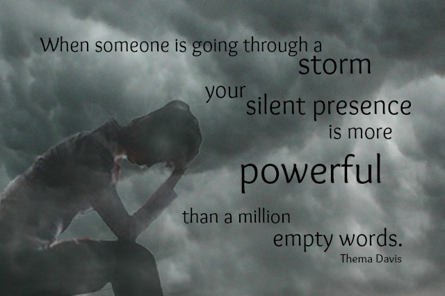 Woman hanging head in despair against storm clouds