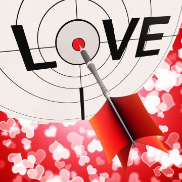 bullseye with dart hitting center of LOVE
