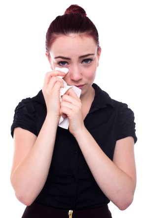 woman wiping away tears